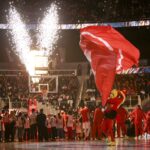 Atlanta Hawks mascot Harry Hawk waves a team flag on the court prior to the game