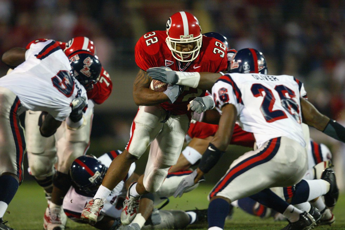 Musa Smith carries the ball