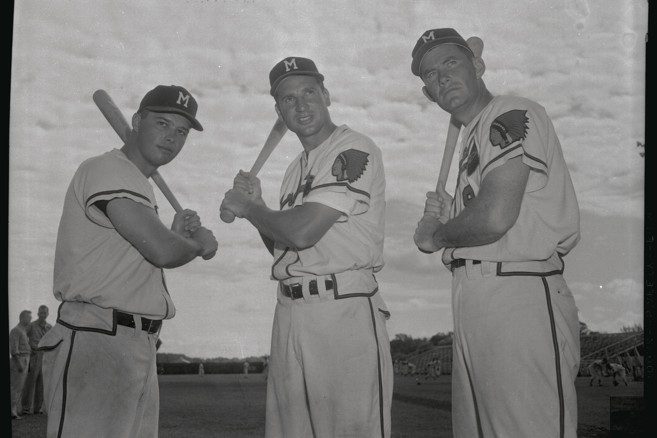 Baseball Players Posing with Baseball Bats