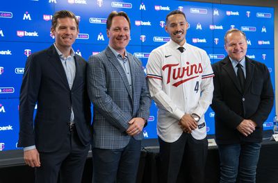 Carlos Correa hugs agent Scott Boras at press conference held for his re-signing with Minnesota Twins