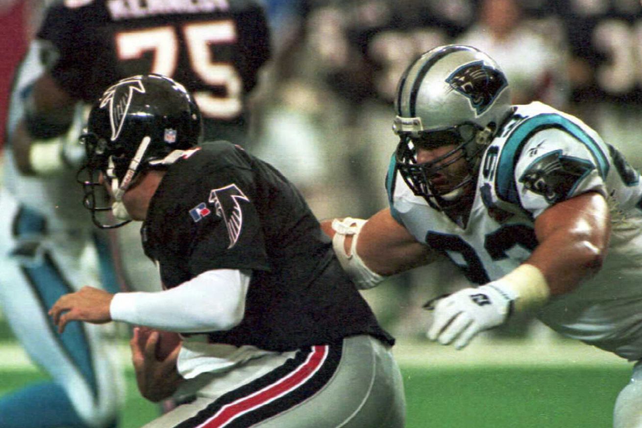 Carolina Panthers defensive end Mike Fox (R) sacks