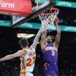 Phoenix Suns guard Bradley Beal dunks over Atlanta Hawks guard Vit Krejci